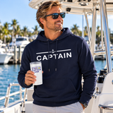 Boat captain holding a personalized insulated tumbler at a tropical marina