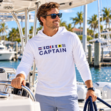 Man wearing Captain hooded boating sun shirt at a tropical marina