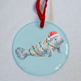 Christmas manatee glass ornament with beveled edge