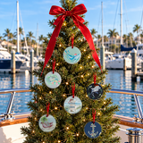 Coastal glass Christmas ornaments with marine-life and nautical designs