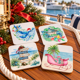 Set of four coastal Christmas drink coasters displayed at a marina